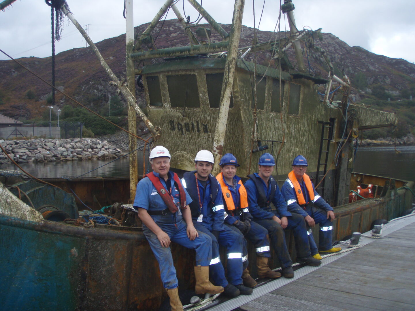 a photo of the briggs team with the aquila