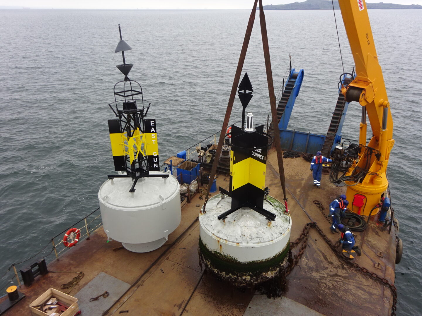a photo of two buoys waiting to be deployed